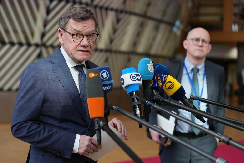 Germany's Foreign Minister Johann Wadephul speaks with the media as he arrives for a meeting of EU foreign ministers at the European Council building in Brussels, Monday, March 16, 2026. (AP Photo/Virginia Mayo)