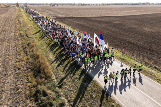An aerial view of students marching through the fields in northern Serbia, as they go to Novi Sad for a huge rally on Nov. 1 marking the first anniversary of a train station disaster that killed 16 people, in Indjija, Serbia, Friday, Oct. 31, 2025. (AP Photo/Armin Durgut) An aerial view of students marching through the fields in northern Serbia, as they go to Novi Sad for a huge rally on Nov. 1 marking the first anniversary of a train station disaster that killed 16 people, in Indjija, Serbia, Friday, Oct. 31, 2025. (AP Photo/Armin Durgut)