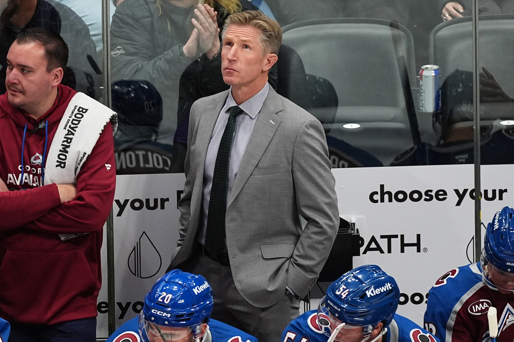 FILE - Colorado Avalanche assistant coach Dave Hakstol looks on from the team box in the first period of an NHL hockey game, Oct. 28, 2025, in Denver. (AP Photo/David Zalubowski, File)