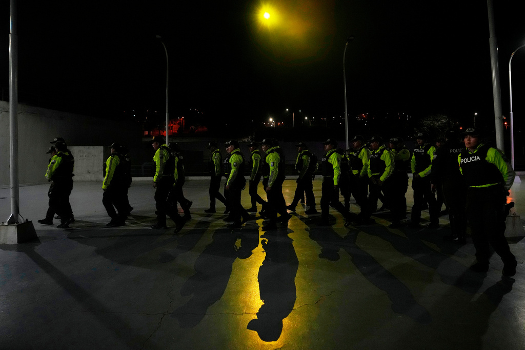 FILE - Police assemble ahead for nighttime curfew patrols as part of a government crackdown on crime in Quito, Ecuador, May 3, 2026. (AP Photo/Dolores Ochoa, File)