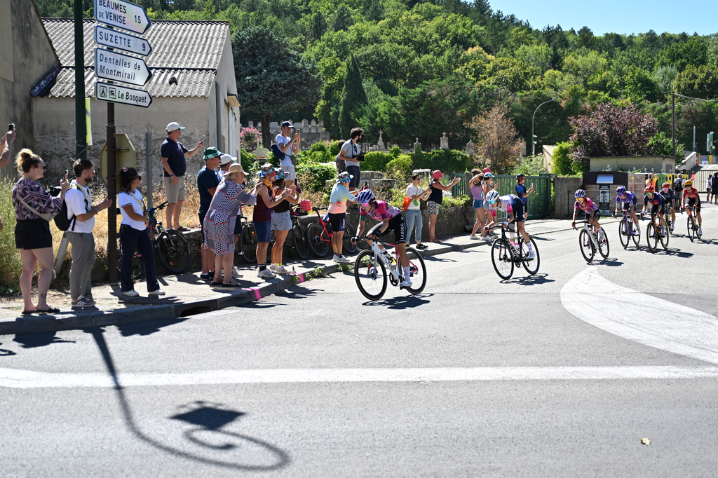 People watch the break away riders during the seventh stage of the Women's Tour de France cycling race (Tour de France Femmes) between La Voulte-sur-Rhone and Mont Ventoux in Malaucene, France, Friday, Aug. 7, 2026. (AP Photo/Philippe Magoni)