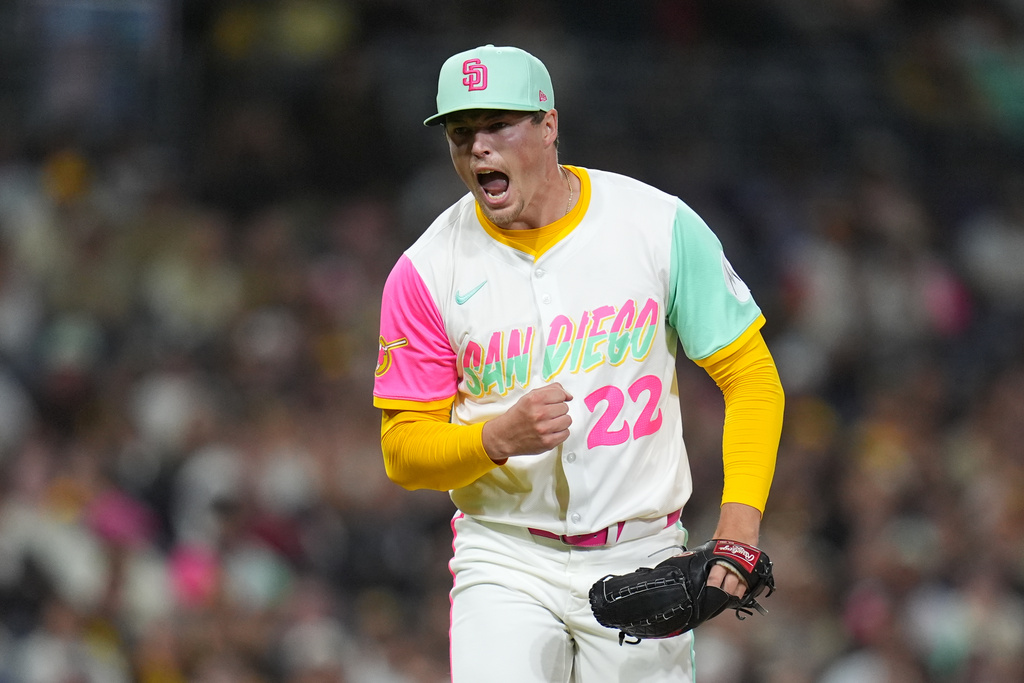 San Diego Padres relief pitcher Mason Miller celebrates after getting the third out during the eighth inning of a baseball game against the Arizona Diamondbacks Friday, Sept. 26, 2025, in San Diego. (AP Photo/Gregory Bull)