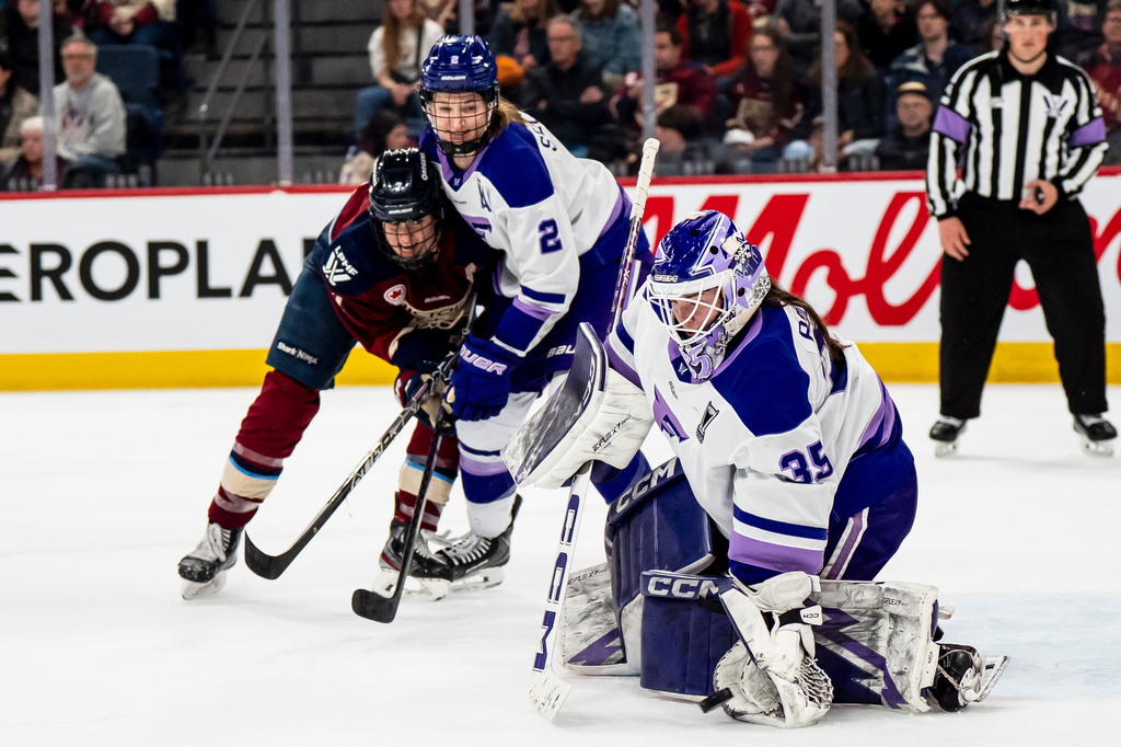 Minnesota Frost goaltender Maddie Rooney (35) makes a glove save against the Montréal Victoire during first overtime period of an PWHL playoff hockey game in Laval, Que., on Tuesday, May 5, 2026. (Christopher Katsarov/The Canadian Press via AP)