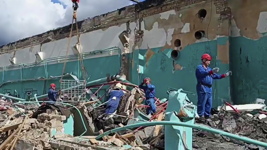 In this photo, released by the Russian Emergency Ministry Press Service on Monday, Aug. 18, 2025, Emergency Ministry employees clear debris at an industrial plant following Friday's fire at the facility in the Shilovsky District, Ryazan region, around 250 kilometers (155 miles) southeast of Moscow, Russia. (Russian Emergency Ministry Press Service via AP)
