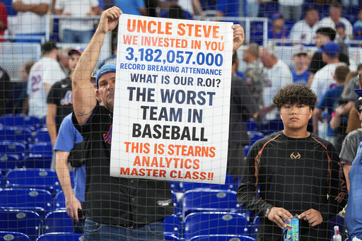 A fan holds up a sign referring to the New York Mets after the Mets lost to the Miami Marlins in a baseball game, Sunday, Sept. 28, 2025, in Miami. (AP Photo/Lynne Sladky) A fan holds up a sign referring to the New York Mets after the Mets lost to the Miami Marlins in a baseball game, Sunday, Sept. 28, 2025, in Miami. (AP Photo/Lynne Sladky)