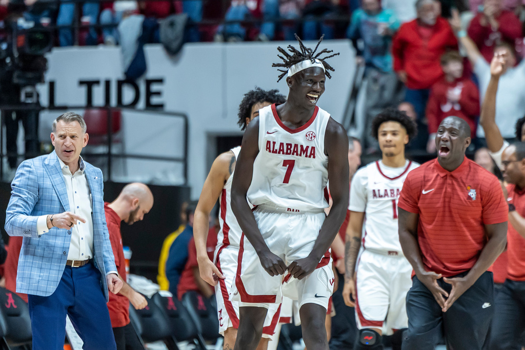 Alabama forward Taylor Bol Bowen (7) celebrates a halftime buzzer-beater 3-point shot against Texas during the first half of an NCAA college basketball game, Saturday, Jan. 10, 2026, in Tuscaloosa, Ala. (AP Photo/Vasha Hunt)