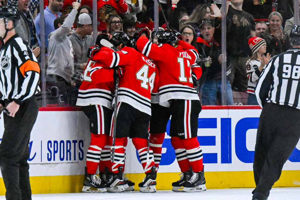 Chicago Blackhawks players celebrate after center Ryan Greene scored during the first period of an NHL hockey game against the Toronto Maple Leafs, Saturday, Nov. 15, 2025, in Chicago. (AP Photo/Matt Marton)