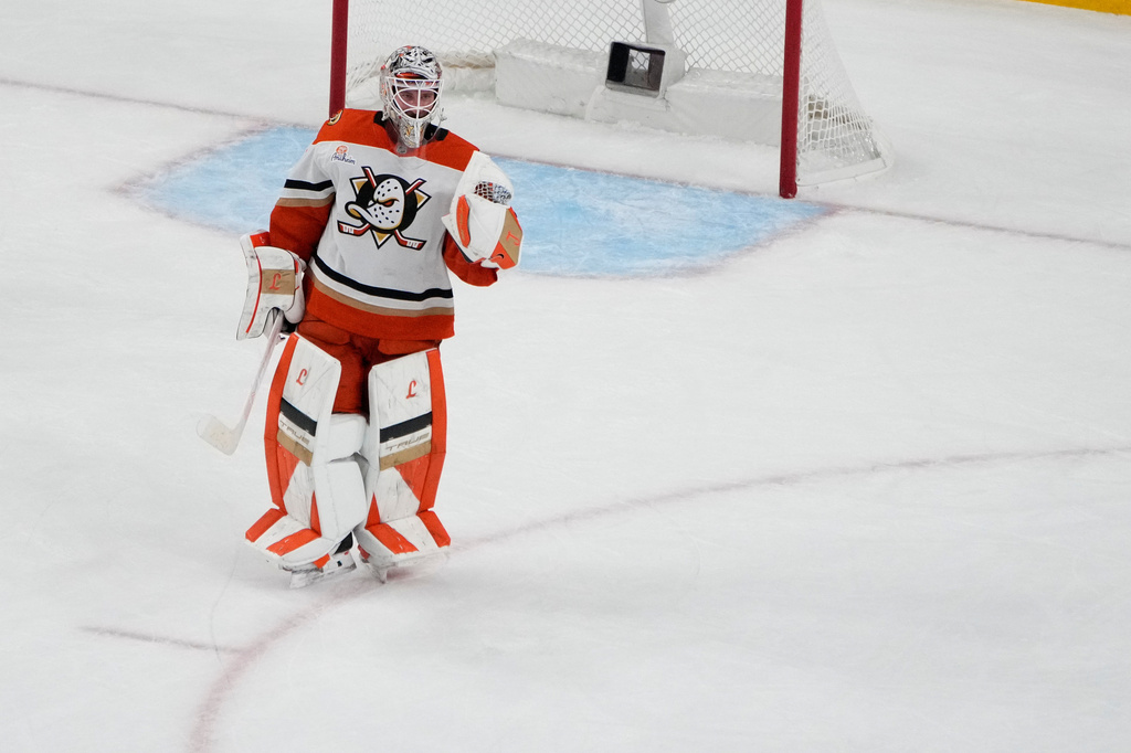Anaheim Ducks goaltender Lukas Dostal (1) celebrates after the Anaheim Ducks defeated the Vegas Golden Knights in Game 2 of a second-round NHL hockey Stanley Cup playoff series Wednesday, May 6, 2026, in Las Vegas. (AP Photo/John Locher)