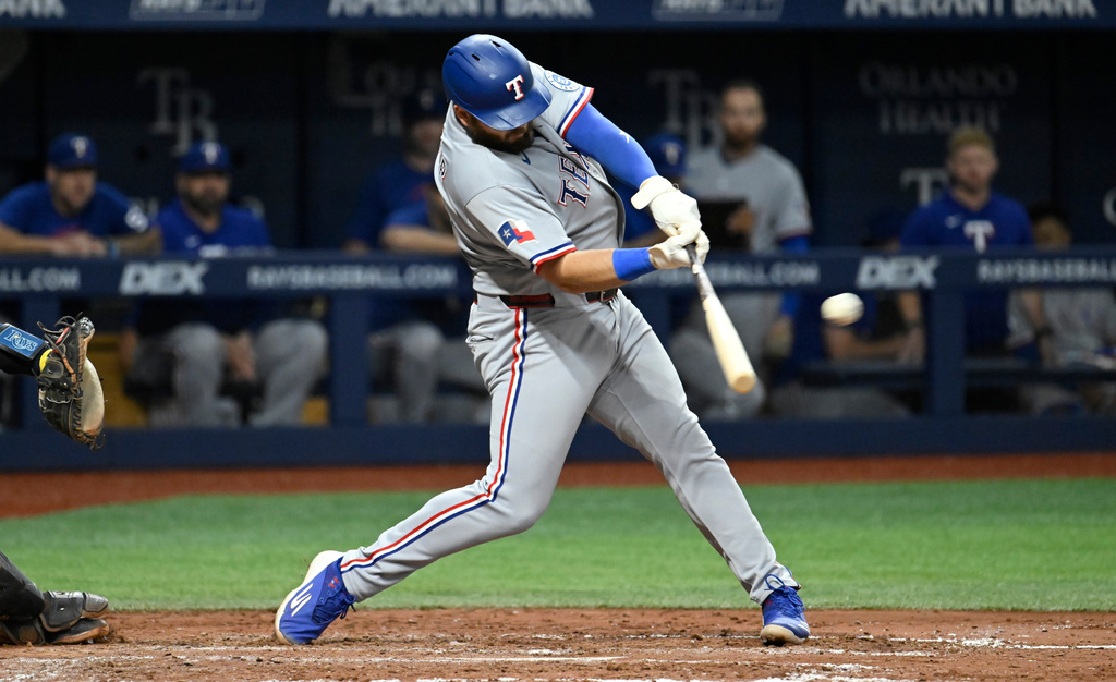 Texas Rangers' Jake Burger doubles during the seventh inning of a baseball game against the Tampa Bay Rays Wednesday, July 29, 2026, in St. Petersburg, Fla. (AP Photo/Jason Behnken)
