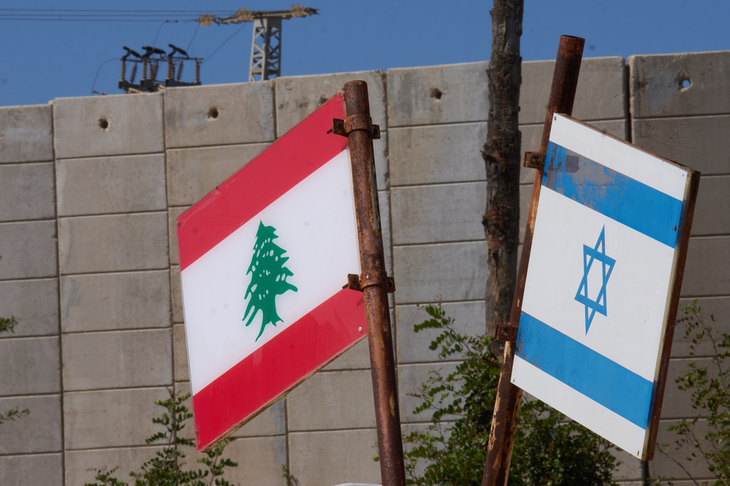 Israeli and Lebanese flags hang in a memorial site on the border with Lebanon in northern Israel, Saturday, June 27, 2026 after Israel and Lebanon sign a framework agreement, described as a first step toward peace following months of conflict between Israel and the Lebanese militant group Hezbollah. (AP Photo/Ariel Schalit)