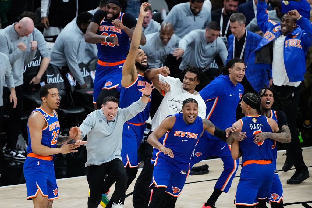 The New York Knicks celebrate after defeating the San Antonio Spurs in Game 5 of the NBA Finals basketball series, Saturday, June 13, 2026, in San Antonio. (AP Photo/Ross D. Franklin)