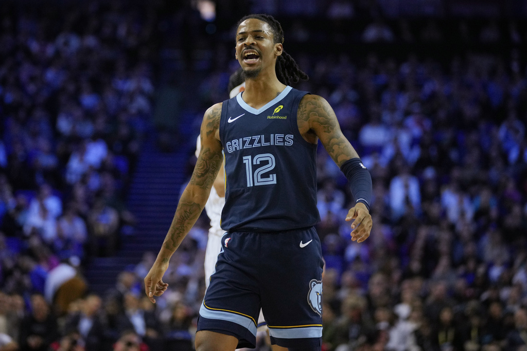 Memphis Grizzlies guard Ja Morant (12) reacts during the first half of NBA basketball game against the Orlando Magic Sunday, Jan. 18, 2026, in London. (AP Photo/Kin Cheung)