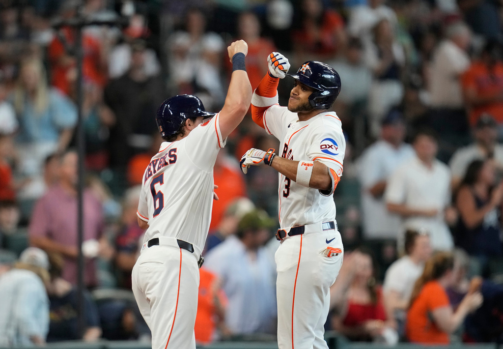 Houston Astros' Jeremy Pena, right, celebrates with Jake Meyers (6) after hitting a two-run home run off Milwaukee Brewers starting pitcher Brandon Sproat during the second inning of a baseball game, Saturday, May 30, 2026, in Houston. (AP Photo/Karen Warren)