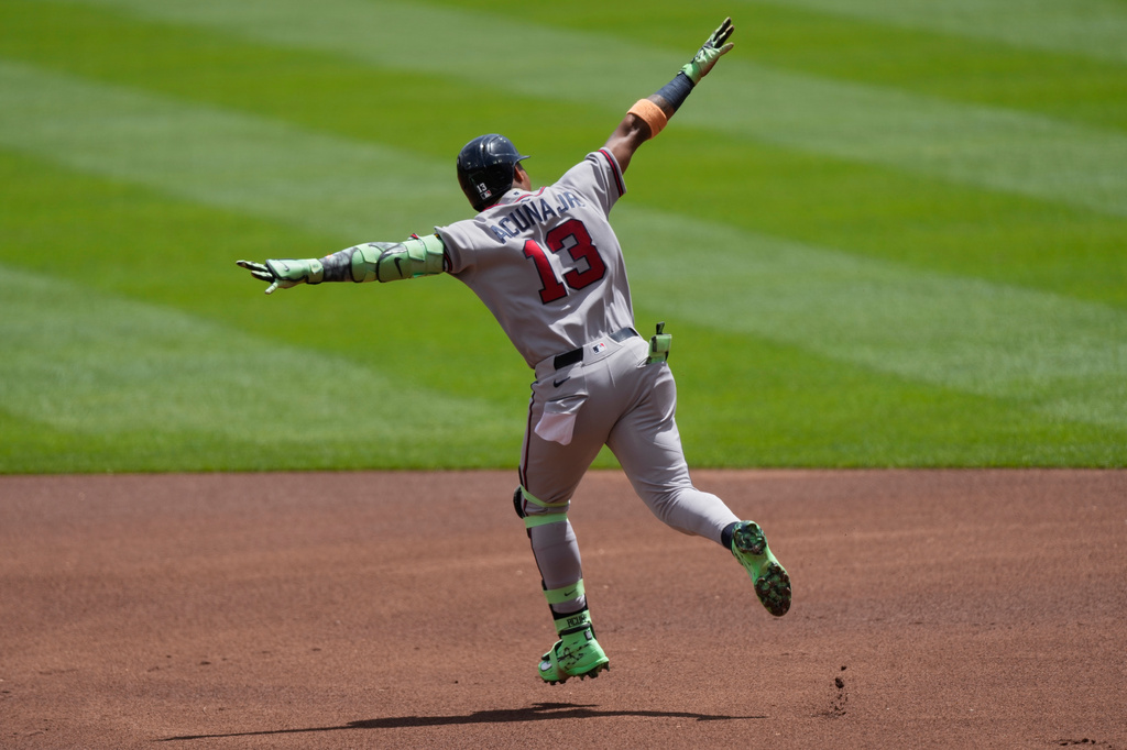 Atlanta Braves' Ronald Acuña Jr. celebrates as he rounds the bases after hitting a solo home run during the first inning of a baseball game against the Cincinnati Reds in Cincinnati, Sunday, May 31, 2026. (AP Photo/Carolyn Kaster)