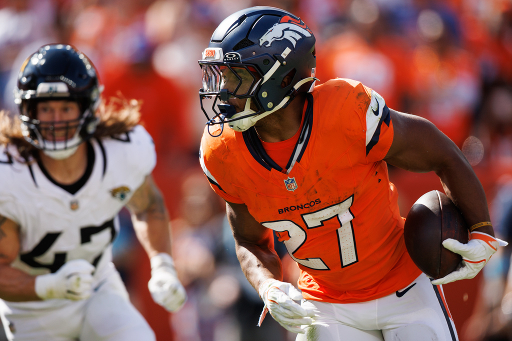 Denver Broncos running back J.K. Dobbins (27) runs with the ball during an NFL football game against the Jacksonville Jaguars, Sunday, Sept. 20, 2026 in Denver. (Gavin Liddell/Denver Broncos via AP)