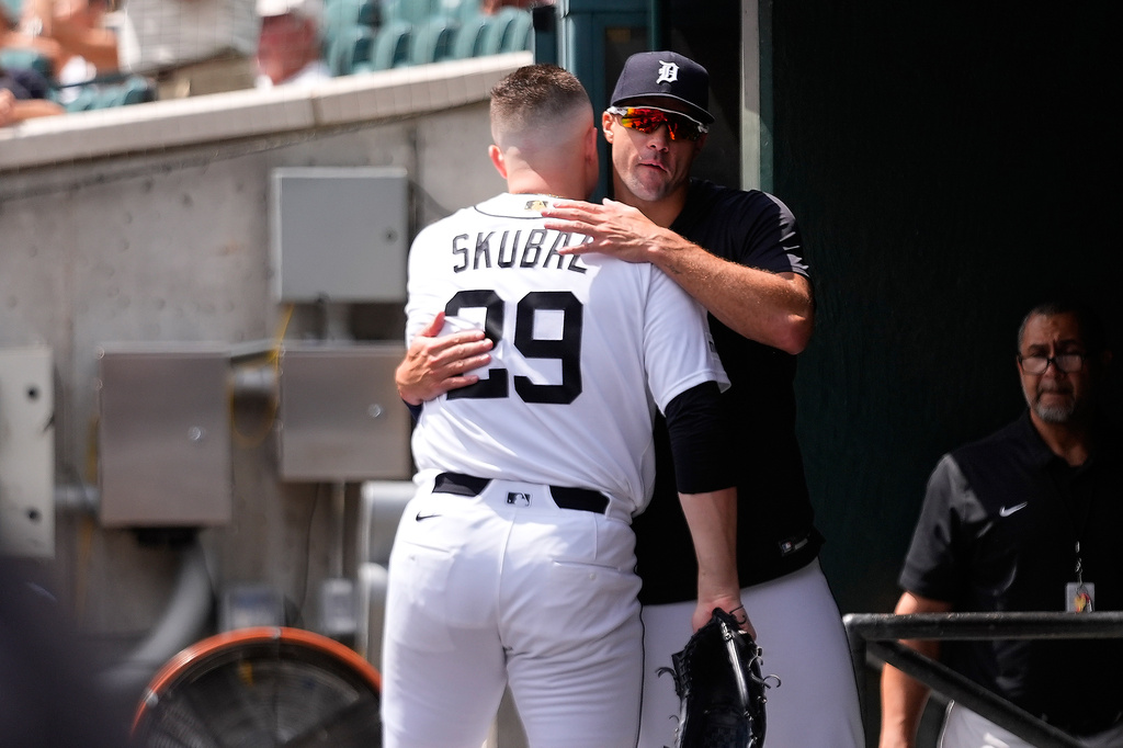 Detroit Tigers pitcher Tarik Skubal (29) hugs Jack Flaherty in the dugout during the seventh inning of a baseball game against the Baltimore Orioles Wednesday, July 29, 2026, in Detroit. (AP Photo/Paul Sancya)