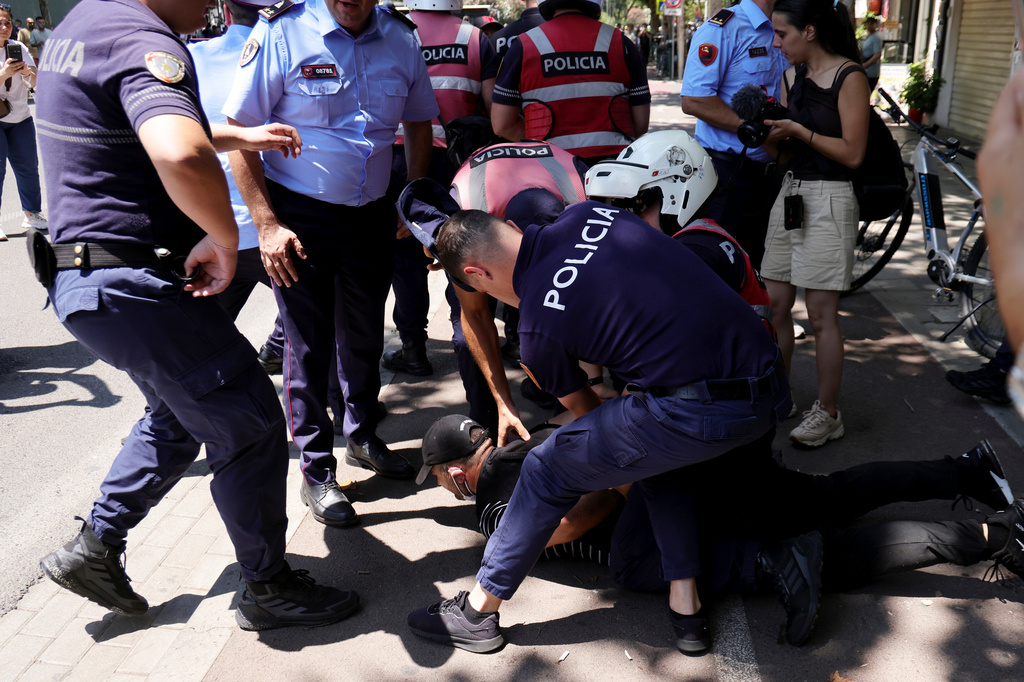 Police detain a protester during clashes at an anti-government rally in Tirana, Albania, Thursday, July 2, 2026. (AP Photo/Hameraldi Agolli)