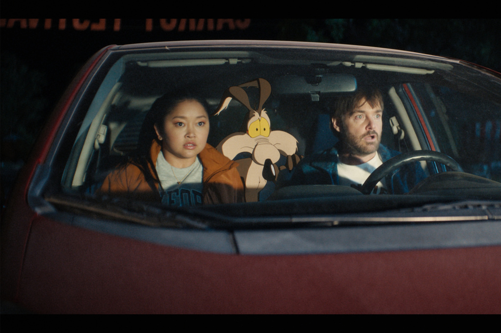 This image released by Ketchup Entertainment shows Lana Condor, left, and Will Forte, right, with the character Wile E. Coyote, voiced by Eric Bauza, in a scene from "Coyote vs Acme." (Ketchup Entertainment via AP)