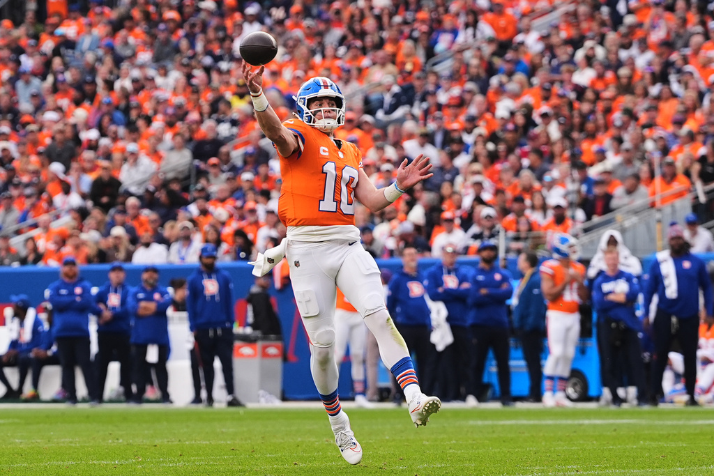 Denver Broncos quarterback Bo Nix throws a pass in the second half of an NFL football game against the Dallas Cowboys Sunday, Oct. 26, 2025, in Denver. (AP Photo/David Zalubowski)