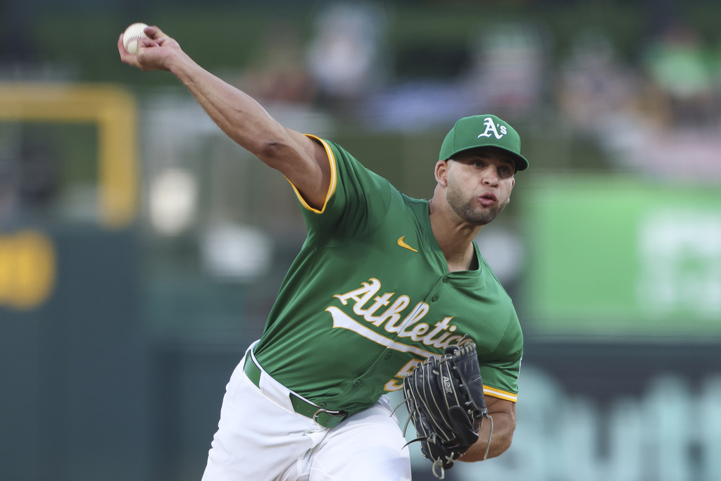 Athletics pitcher Luis Morales throws to an Boston Red Sox batter during the first inning of a baseball game Monday, Sept. 8, 2025, in West Sacramento, Calif. (AP Photo/Scott Marshall)
