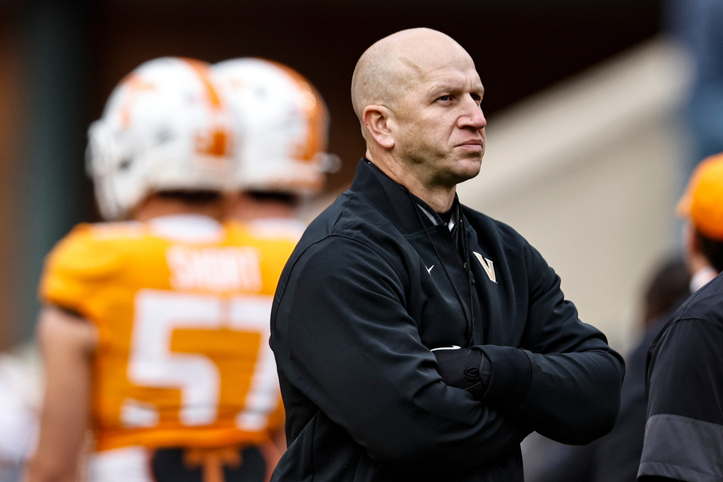 Vanderbilt head coach Clark Lea watches as his team warms up before an NCAA college football game against Tennessee, Saturday, Nov. 29, 2025, in Knoxville, Tenn. (AP Photo/Wade Payne)