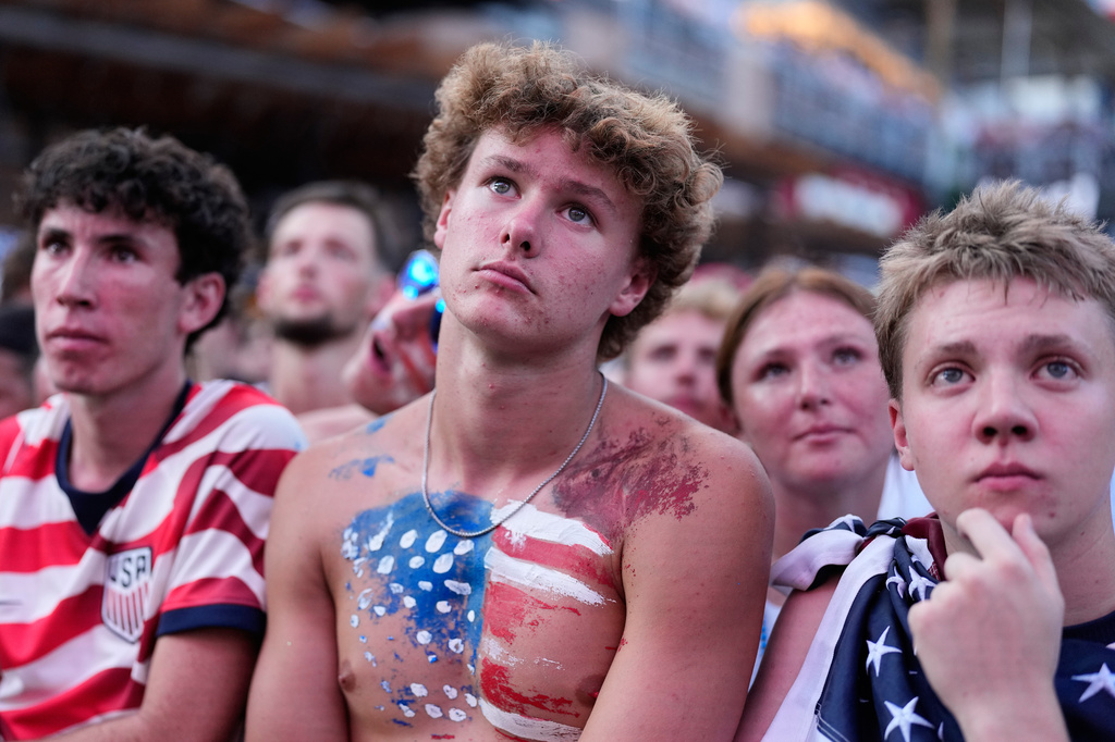 Fans watch a World Cup round of 16 soccer match between the United States and Belgium at the KC Live! entertainment district Monday, July 6, 2026, in Kansas City, Mo. (AP Photo/Charlie Riedel)