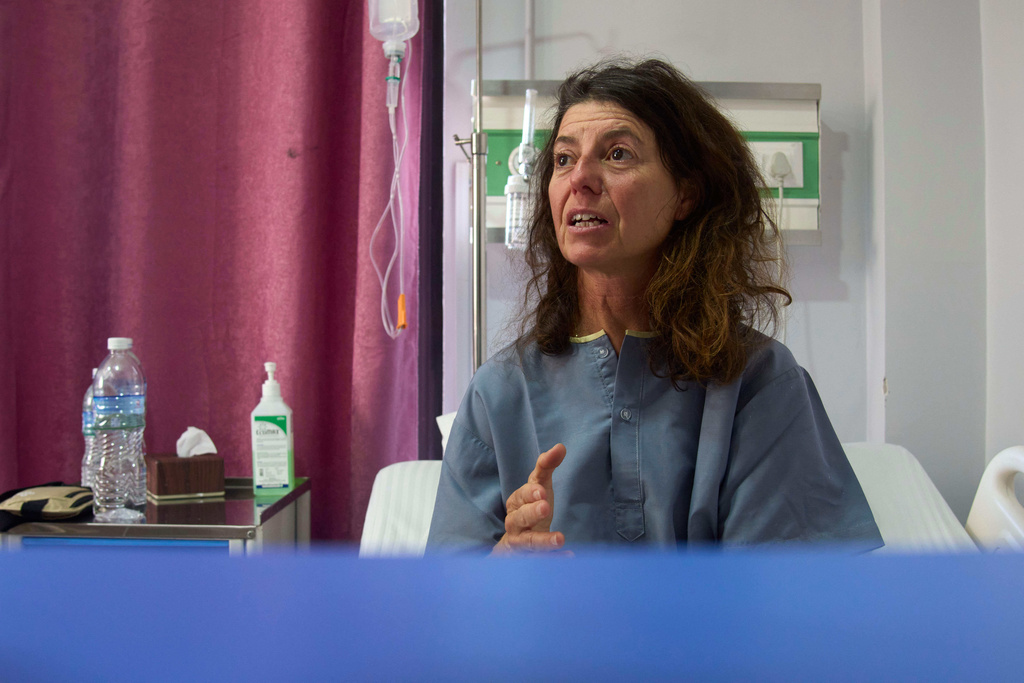 Isabelle Solange, a survivor of an avalanche on Mount Yalung Ri, speaks to the media after being rescued and airlifted to a hospital in Kathmandu, Nepal, Tuesday, Nov. 4, 2025. (AP Photo/Niranjan Shrestha)