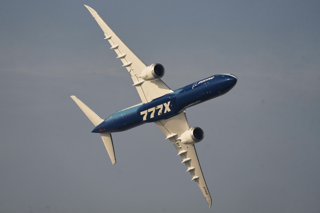 A Boeing 777X performs during the Dubai Air Show in Dubai, United Arab Emirates, Tuesday, Nov. 18, 2025. (AP Photo/Fatima Shbair)