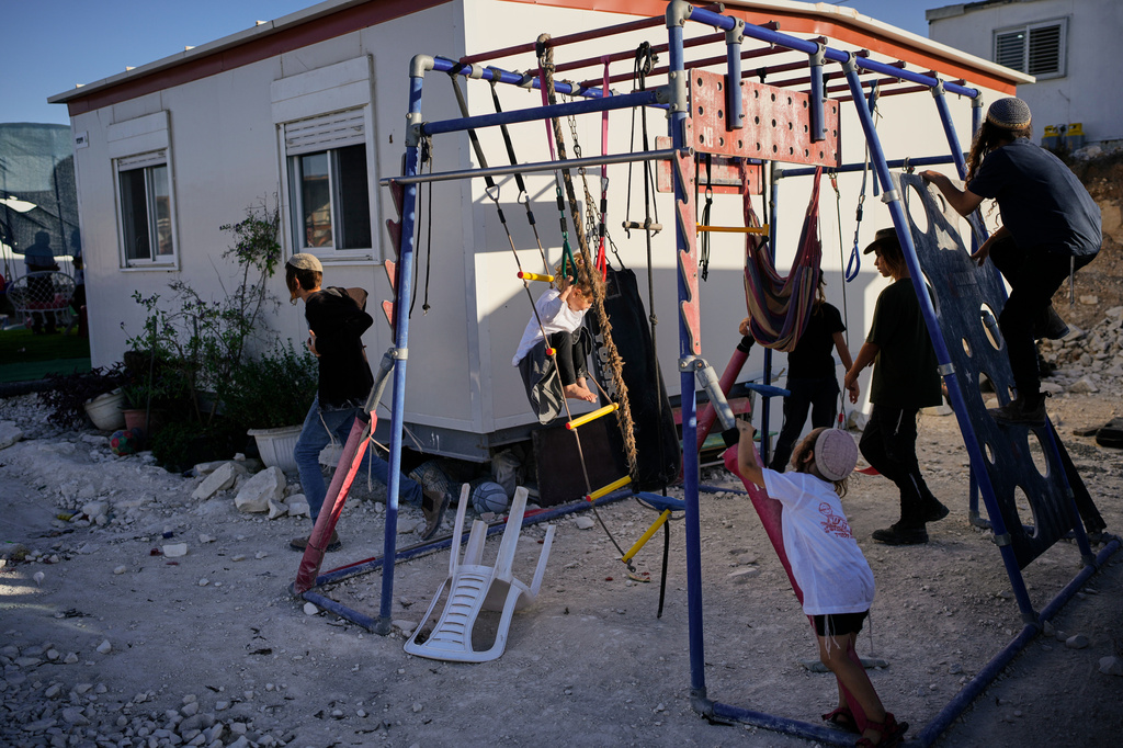 Israeli settlers gather to celebrate the inauguration of a newly built synagogue at the occupied West Bank outpost of Homesh, Wednesday, Sept. 16, 2026. (AP Photo/Ohad Zwigenberg)