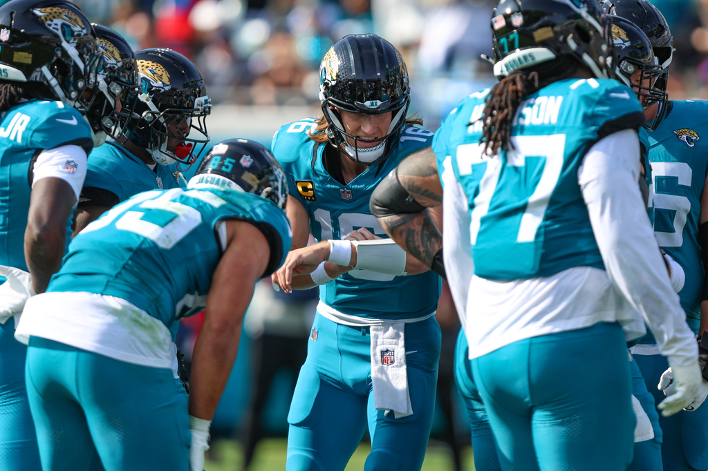 FILE - Jacksonville Jaguars quarterback Trevor Lawrence (16) gives the play in a huddle against the Buffalo Bills in an NFL wild card playoff football game, Jan. 11, 2026, in Jacksonville, Fla. (AP Photo/Gary McCullough, File)