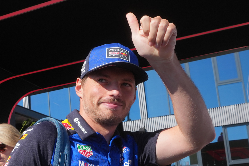 Red Bull driver Max Verstappen of the Netherlands gives a thumbs up to fans as he arrives in the paddock prior to the first free practice ahead of Sunday's Italy Grand Prix, at the Monza racetrack, Italy, Friday, Sept. 4, 2026. (AP Photo/Luca Bruno)