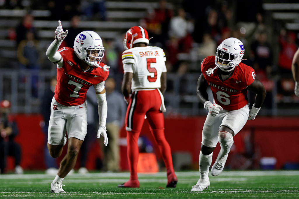 Rutgers defensive back Cam Miller (7) reacts after breaking up a pass intended by Maryland wide receiver Octavian Smith Jr. (5) during the second half of an NCAA college football game Saturday, Nov. 8, 2025, in Piscataway, N.J. (AP Photo/Adam Hunger)