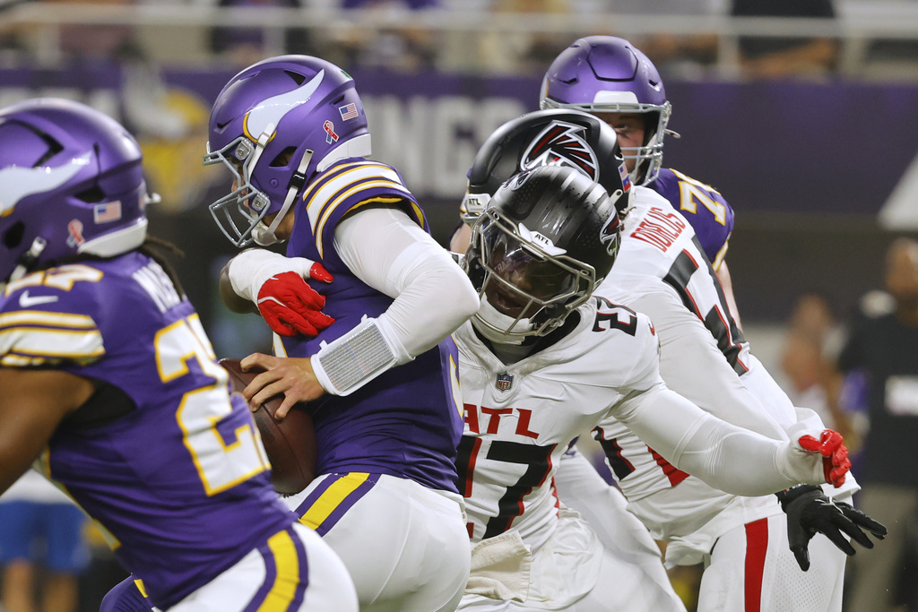 Atlanta Falcons linebacker James Pearce Jr. (27) sacks Minnesota Vikings quarterback J.J. McCarthy (9) during the first half of an NFL football game, Sunday, Sept. 14, 2025, in Minneapolis. (AP Photo/Bruce Kluckhohn)