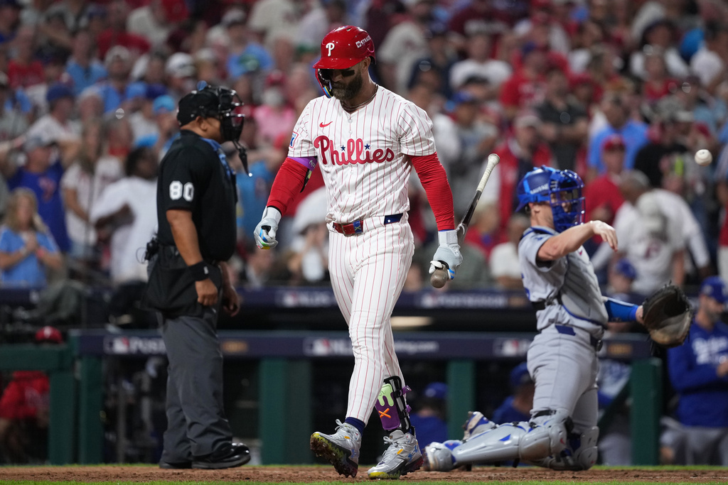 Philadelphia Phillies' Bryce Harper reacts after striking out swinging during the sixth inning in Game 2 of baseball's National League Division Series against the Los Angeles Dodgers, Monday, Oct. 6, 2025, in Philadelphia. (AP Photo/Matt Slocum)