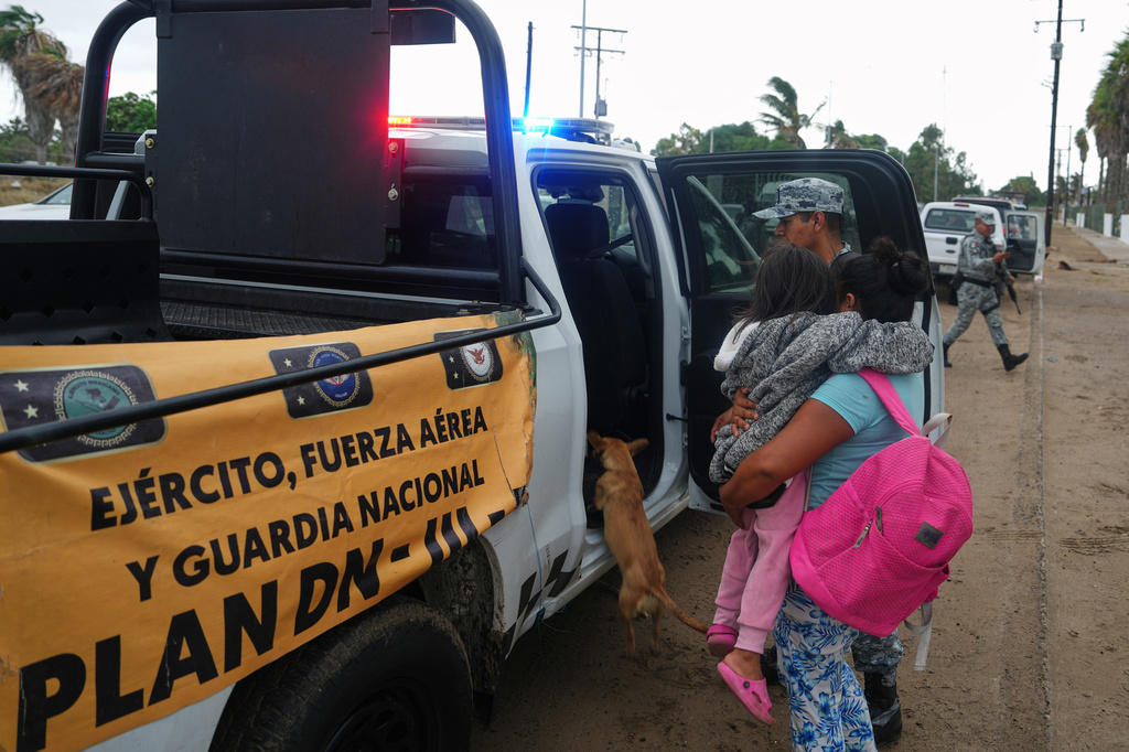 Residents are evacuated by the Army as Hurricane Polo approaches Puerto San Carlos, Baja California Sur state, Mexico, Monday, Sept. 28, 2026. (AP Photo/Eduardo Verdugo)