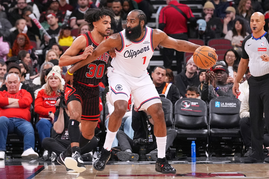 LA Clippers guard James Harden, right, drives as Chicago Bulls guard Tre Jones guards during the first half of an NBA basketball game in Chicago, Tuesday, Jan. 20, 2026. (AP Photo/Nam Y. Huh)