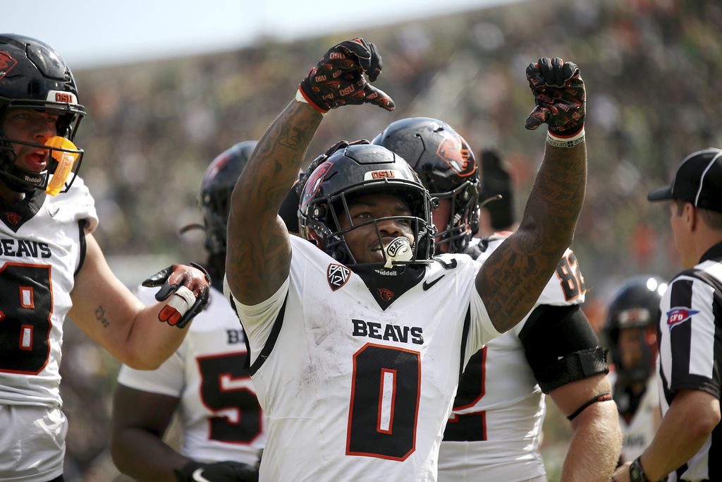 Oregon State running back Anthony Hankerson (0) celebrates his touchdown during the first half of an NCAA college football game against Oregon, Saturday, Sept. 20, 2025, in Eugene, Ore. (AP Photo/Lydia Ely)