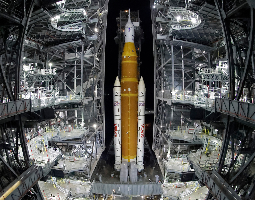 FILE - The NASA Artemis II rocket, with the Orion spacecraft aboard, leaves the Vehicle Assembly Building at the Kennedy Space Center in Cape Canaveral, Fla., March 20, 2026. (AP Photo/Terry Renna, File)
