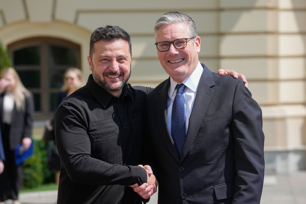 Britain's Prime Minister Keir Starmer, right, and Ukraine's President Volodymyr Zelenskyy greet each other in Kyiv, Ukraine, Thursday July 16, 2026. (AP Photo/Efrem Lukatsky)