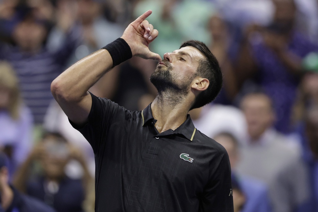 Novak Djokovic, of Serbia, reacts after defeating Taylor Fritz, of the United States, during the quarterfinal round of the U.S. Open tennis championships, Tuesday, Sept. 2, 2025, in New York. (AP Photo/Adam Hunger)
