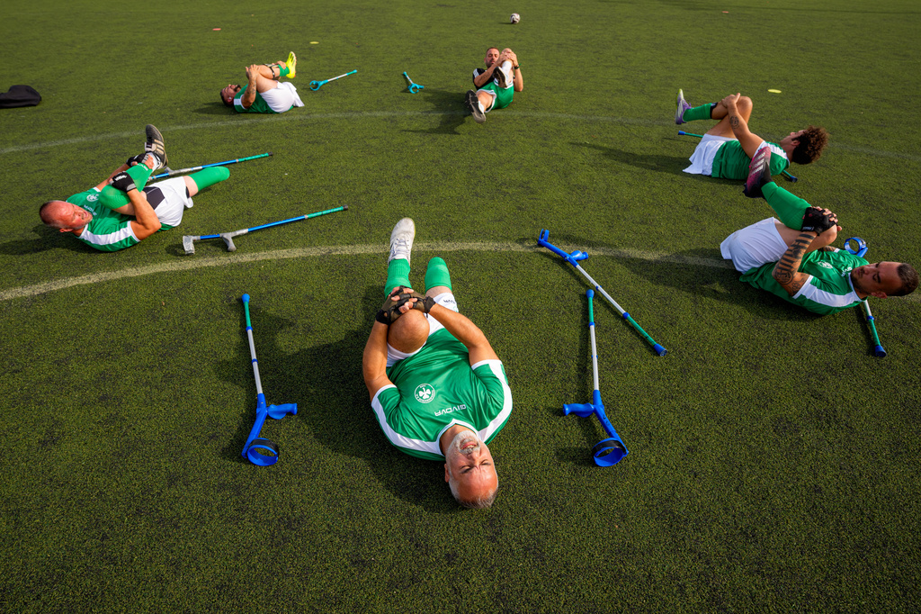 Panathinaikos' players warm-up before an amputee soccer match between FCSB and Panathinaikos in the inaugural EAFF Conference League in Bucharest, Romania, Friday, Sept. 25, 2026. (AP Photo/Andreea Alexandru)