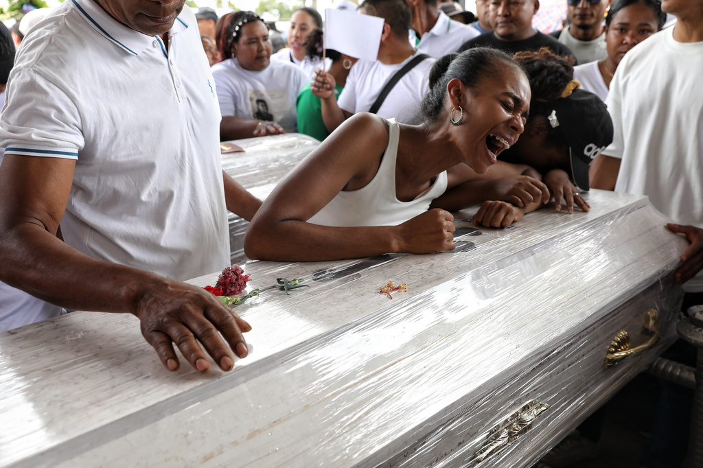 FILE - Relatives mourn during a funeral for victims who were killed in an attack on the Pan-American Highway that authorities blamed on dissident former FARC rebels, in Cajibio, Colombia, Tuesday, April 28, 2026. (AP Photo/Santiago Saldarriaga, File)