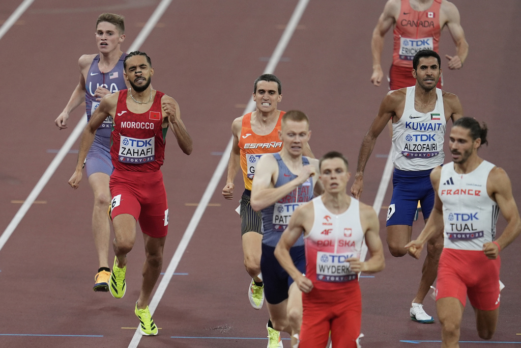 United States' Cooper Lutkenhaus, left, competes in the men's 800 meters heat at the World Athletics Championships in Tokyo, Tuesday, Sept. 16, 2025. (AP Photo/Abbie Parr)