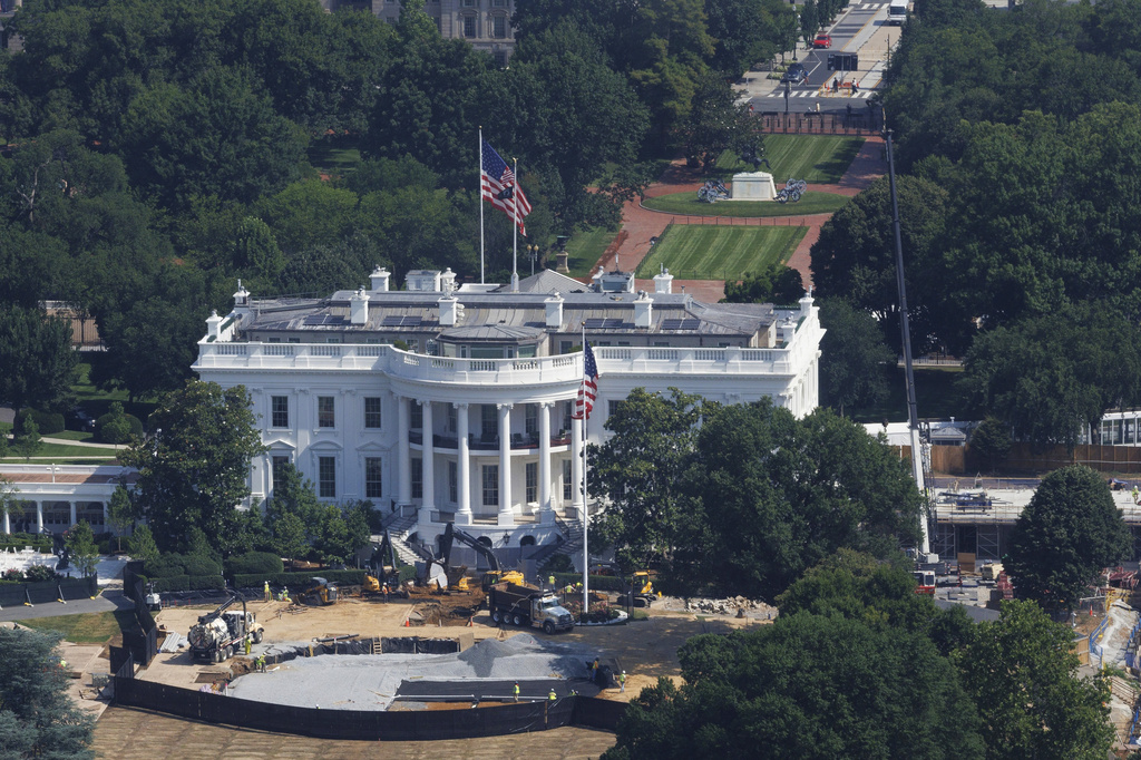 Construction workers continue designing a helipad for Marine One at the White House South Lawn, Wednesday, July 1, 2026, in Washington. (AP Photo/Tom Brenner)