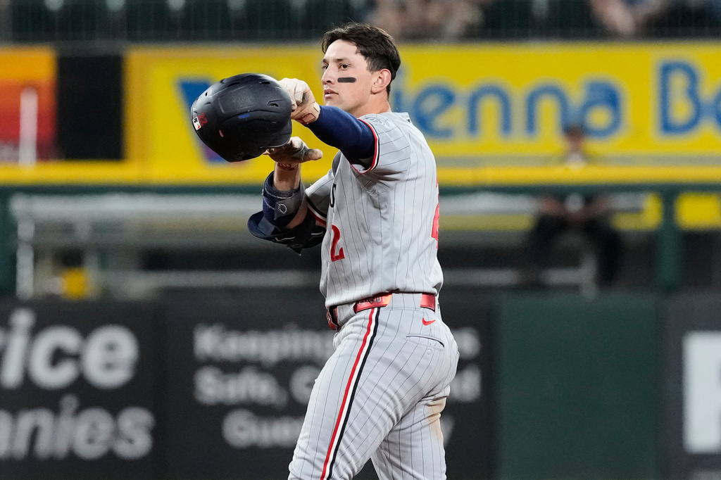 Minnesota Twins' Brooks Lee celebrates after hitting a three-run double during the 11th inning of a baseball game against the Chicago White Sox in Chicago, Tuesday, May 26, 2026. (AP Photo/Nam Y. Huh)