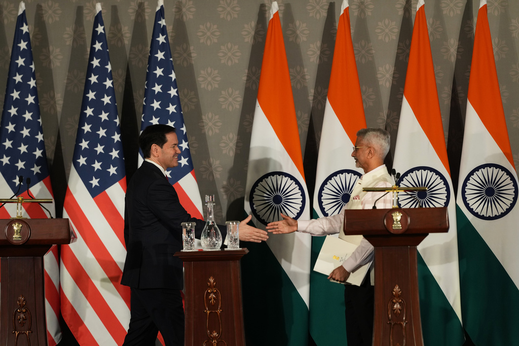 United States Secretary of State Marco Rubio, left, walks to shake hands with India's Minister of External Affairs S. Jaishankar after addressing a joint press conference following their talks in New Delhi, India, Sunday, May 24, 2026. (AP Photo/Manish Swarup)