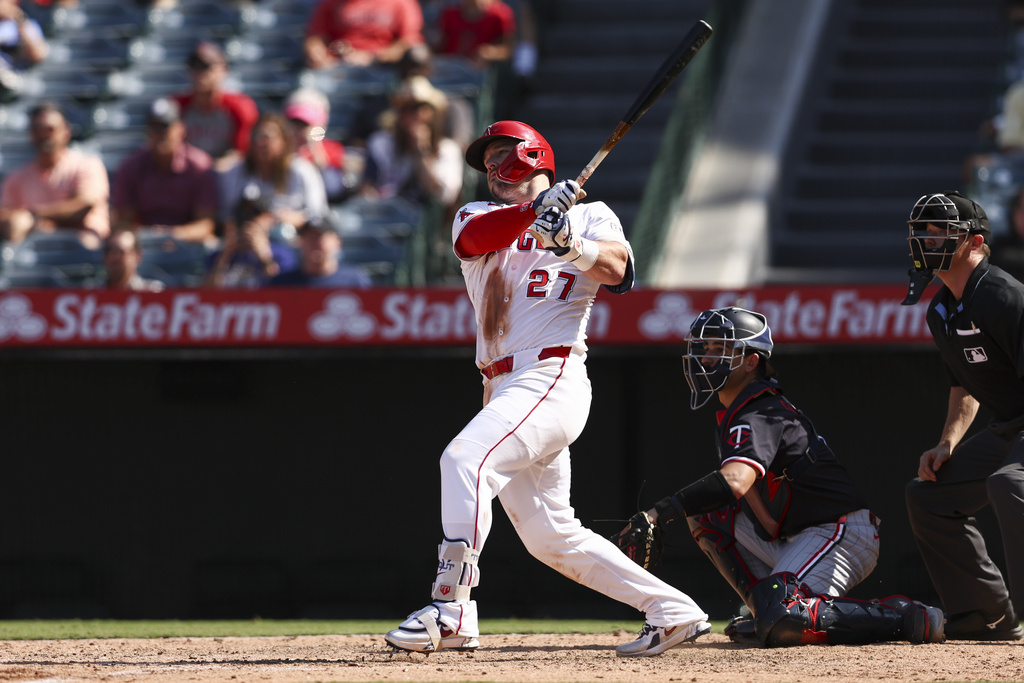 Los Angeles Angels' Mike Trout follows through on a sacrifice fly during the eighth inning of a baseball game against the Minnesota Twins, Wednesday, Sept. 10, 2025, in Anaheim, Calif. (AP Photo/Jessie Alcheh)
