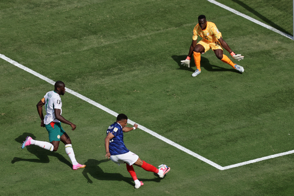 France's Kylian Mbappe scores their opening goal during the World Cup Group I soccer match between France and Senegal in East Rutherford, N.J., near New York, Tuesday, June 16, 2026. (AP Photo/Adam Hunger)