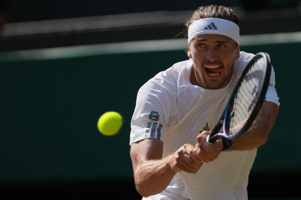Alexander Zverev of Germany returns the ball to Taylor Fritz of the United States in their quarter-final men's singles match at the Wimbledon Tennis Championships in London, Wednesday, July 8, 2026. (AP Photo/Kin Cheung)