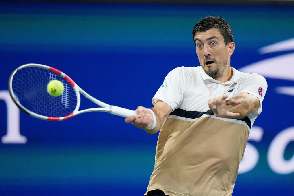 FILE - Sebastian Ofner, of Austria, returns a shot to Casper Ruud, of Norway, during the first round of the U.S. Open tennis championships, Monday, Aug. 25, 2025, in New York. (AP Photo/Frank Franklin II, file)